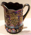 Carnival Glass purple grape & cable pitcher by Northwood Glass Co. at Museum of American Glass. Milville, NJ.