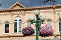 Catron Block over streetlight & flowers. Santa Fe, NM.