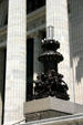 Lamp stands with statues of students on steps of New York State Education Department. Albany, NY.