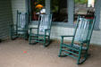 Rocking chairs on veranda of Roycroft Inn reflect era of Elbert Hubbard who died on sinking of S.S. Lusitania. East Aurora, NY.