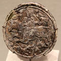 Islamic glass medallion with falconer at Corning Museum of Glass. Corning, NY.