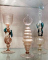 Venetian glass goblet with winged creature & rose water sprinklers at Corning Museum of Glass. Corning, NY.
