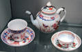 Central European glass tea cups & pot with floral designs at Corning Museum of Glass. Corning, NY.