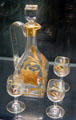 French glass trapezium-shaped gilded liqueur set by Baccarat at Corning Museum of Glass. Corning, NY.