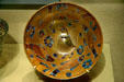 Islamic glass cup with bird & five fish at Corning Museum of Glass. Corning, NY.
