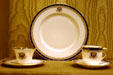 Lenox china with Roosevelt's family symbols mixed with Presidential crest used in White House in Presidential Museum. Hyde Park, NY.