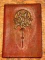 Leather work billfold by George Scheide Mantel at Elbert Hubbard Roycroft Museum. East Aurora, NY.