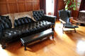 Sofa with leopard skin throw & wide arm reclining chair in billiard room at Eastman House. Rochester, NY.