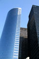 17 State St. surrounded by black towers of One Battery Park Plaza. New York, NY.