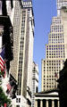 Looking up Broad Street across New York Stock Exchange & Federal Hall. New York, NY.