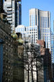 Streetscape up Lexington Ave. with concave 135 E 57th over Central Synagogue. New York, NY.