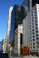 Blue windowed Banque de Paris Building surrounded by various highrises. New York, NY.