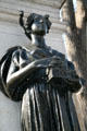 Bronze female figure carrying building by Daniel Chester French at Richard Morris Hunt's memorial in Central Park. New York, NY.