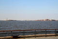 New York harbor view between Statue of Liberty & Ellis Island. New York, NY.