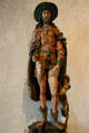 Gilded wood carving of St Roch with dog from Normandy, France at The Cloisters. New York, NY