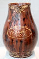 Redware pitcher with slip decoration prob. from Pennsylvania at Metropolitan Museum of Art. New York, NY.