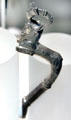 Egyptian silver vessel handle in shape of bounding ibex in Persian style probably from Tell el-Maskhuta, Egypt at Brooklyn Museum. Brooklyn, NY.