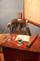 Captain's quarters objects including chest, inkwell, telescope & Windsor chair at Whaling Museum. Cold Spring Harbor, NY.