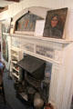 Fireplace surrounded by artwork of Annie Cooper Boyd at Boyd House museum. Sag Harbor, NY