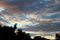 Early evening sky with sunset reflected on storm clouds. Bridgehampton, NY