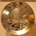 Golden gold miner's pan with nuggets presented to President Roosevelt by Arctic Brotherhood in Alaska at Old Orchard Museum at Sagamore Hill NHS. Cove Neck, NY.