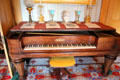 Chickering piano in parlor with girandoles, vases & bust at Taft House NHS. Cincinnati, OH.
