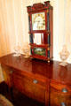 Mantle clock & sweetmeat jars on reproduction sideboard in dining room of Monroe House at Oberlin Heritage Center. Oberlin, OH.