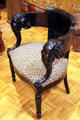 Armchair with carved elephant arms and tapestry seat among McKinley's White House furnishings at William McKinley Presidential Museum & Library. Canton, OH.