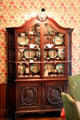 Dutch Renaissance vitrine containing English Tower Spode china in dining room at Hower House. Akron, OH.