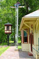 Semaphore signal plus yard switching cabin beside Bowling Green rail station at Carillon Historical Park. Dayton, OH.