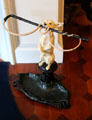 Umbrella stand in shape of dog holding whip at Chepstow. Newport, RI