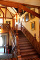 Stick staircase with society portraits at Newport Art Museum. Newport, RI.
