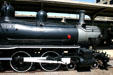 Boiler & drive wheels of Cook Locomotive Works 4-6-0 steam locomotive at Railroad Museum. Galveston, TX.