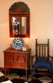Early American furniture, mirror, cabinet & great chair in Murphy room at Bayou Bend. Houston, TX.