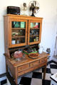 Kitchen cupboard with built-in flour bin in Staiti House at Sam Houston Park. Houston, TX.