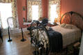 Bent metal bedstead in Staiti House at Sam Houston Park. Houston, TX.