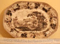 Transfer print platter over embroidered German saying at Edward Steves Homestead Museum. San Antonio, TX.