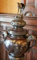 Detail of birds depicted on decorative Oriental metal urn in central hall at McFaddin-Ward House. Beaumont, TX.