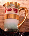 Painted pitcher with cherries in dining room at McFaddin-Ward House. Beaumont, TX.