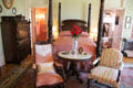 Four poster bed with carved tobacco leaf pattern in master bedroom at McFaddin-Ward House. Beaumont, TX.