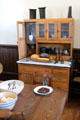 Kitchen cupboard with built-in flour bin at Fort House. Waco, TX.