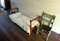Small bed & chair in hallway at John Jay French Museum. Beaumont, TX.