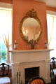 Convex mirror over parlor fireplace at Neill-Cochran House Museum. Austin, TX.