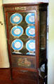 Vitrine with blue porcelain plates at French Legation Museum. Austin, TX.