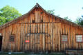 Barn containing Sadue collection of handmade miniature wagons at Museum of Texas Handmade Furniture / Museum of Texas Handmade Furniture. New Braunfels, TX.
