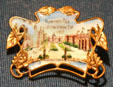 Jamestown Exposition souvenir pin with view from pier at Hampton Roads Naval Museum. Norfolk, VA.
