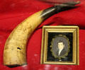 Engraved powder horn & settler's portrait at Vermont History Museum. Montpelier, VT.