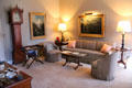 Upstairs sitting area with tall clock & paintings at Marsh-Billings-Rockefeller Mansion. Woodstock, VT.