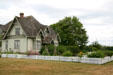White picket fence & gardens around Hovander Homestead house. Ferndale, WA.