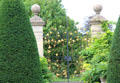Gate with ornate gilded iron work vine at St Fagans Castle. Cardiff, Wales.
